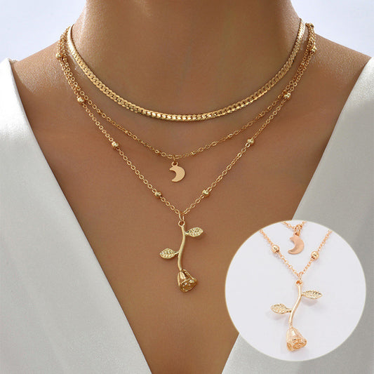 Close-up of Bohemia multilayer moon gold pendant necklace with rose flower choker, elegant jewelry for women