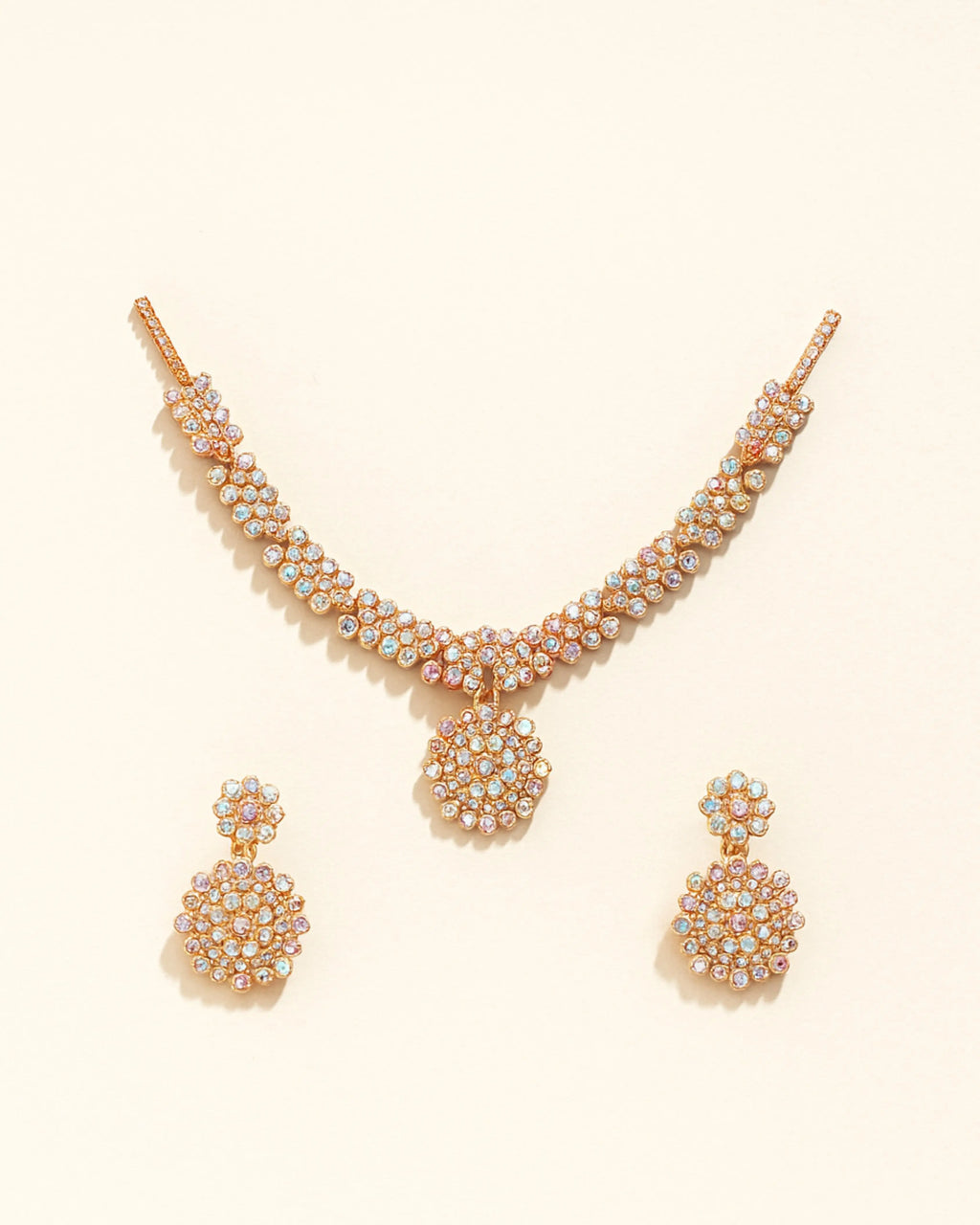 Elegant gold-plated Austrian Diamond Jewellery Set for women, featuring a sparkling necklace, earrings, and ring.