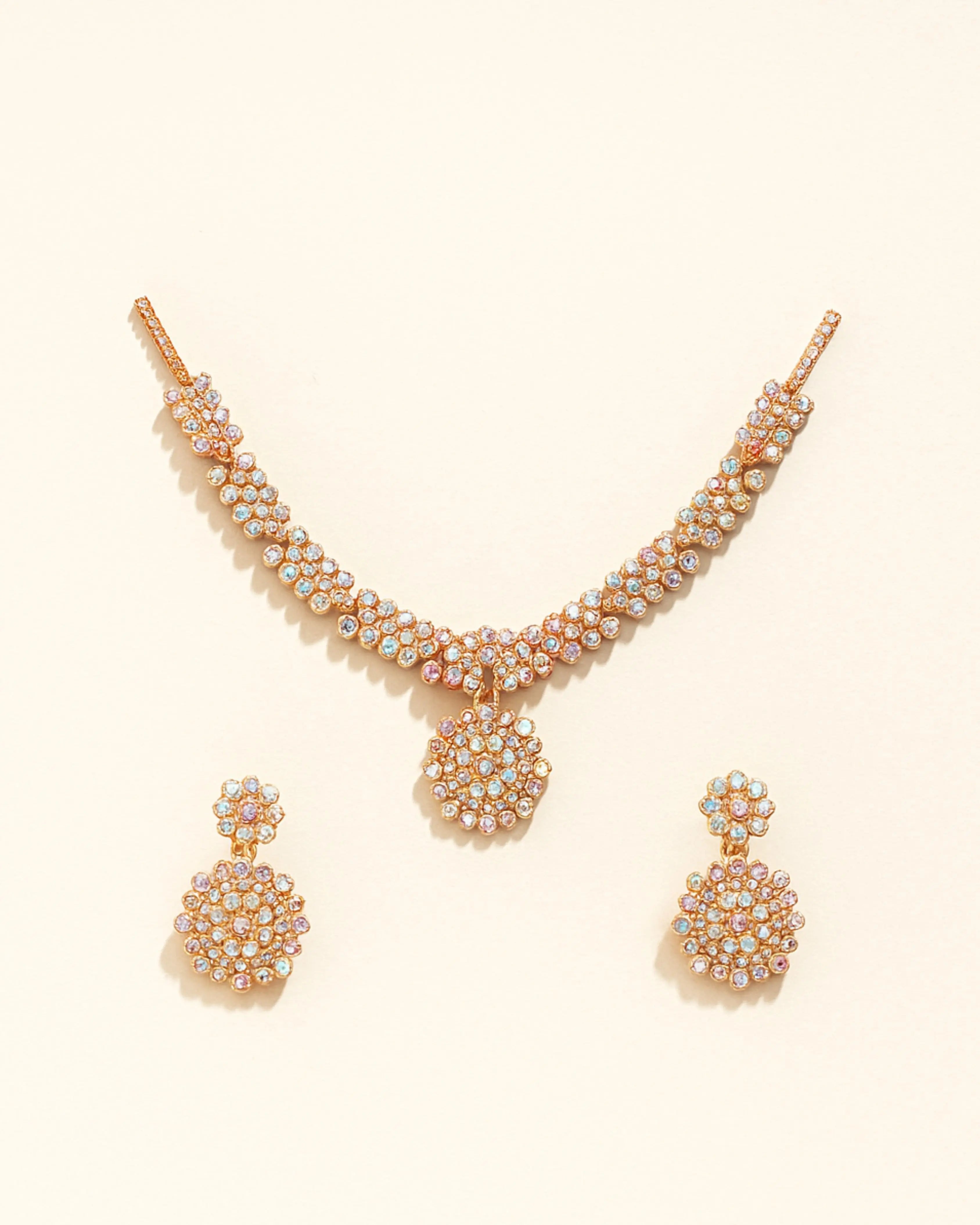 Elegant gold-plated Austrian Diamond Jewellery Set for women, featuring a sparkling necklace, earrings, and ring.