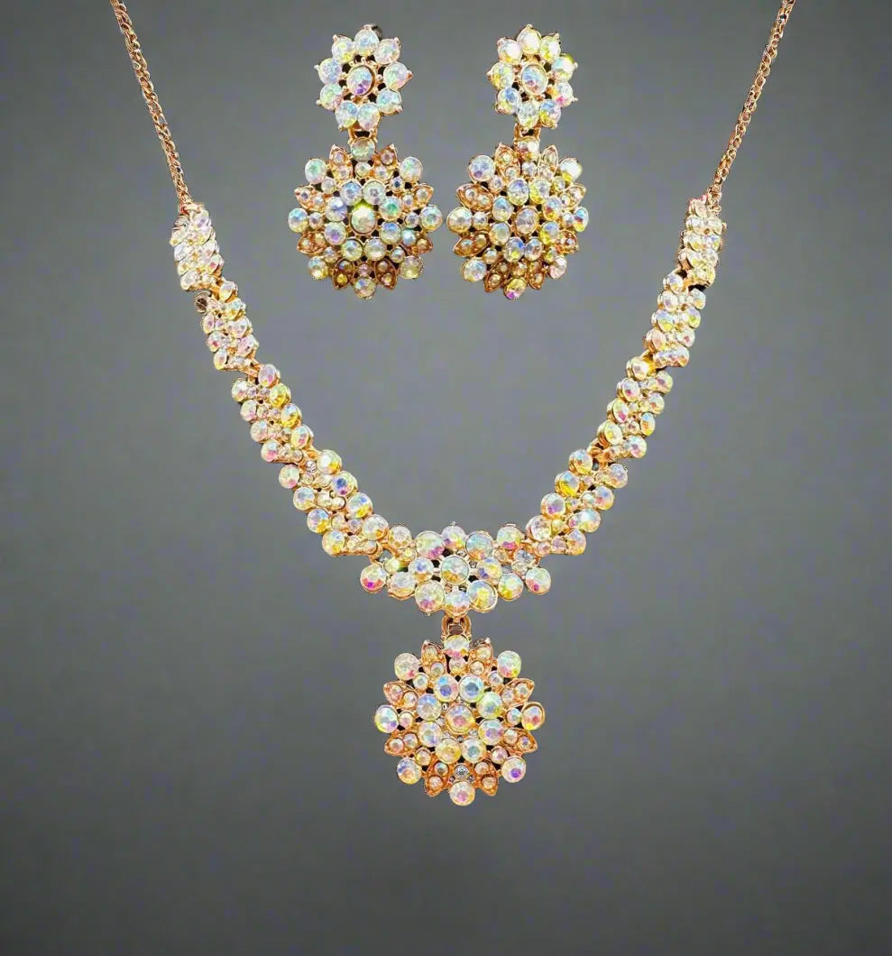 Elegant gold-plated Austrian Diamond jewellery set for women, featuring a sparkling necklace, earrings, and ring.