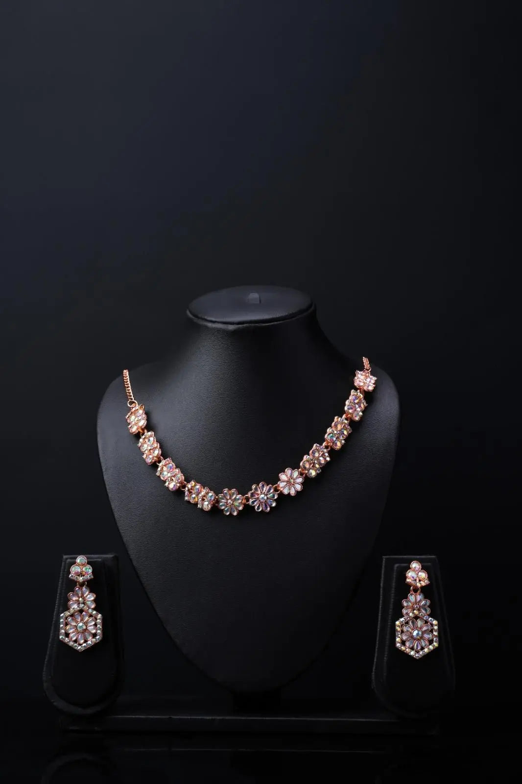 Elegant gold-plated Austrian Diamond jewellery set for women, featuring a sparkling necklace, earrings, and ring.