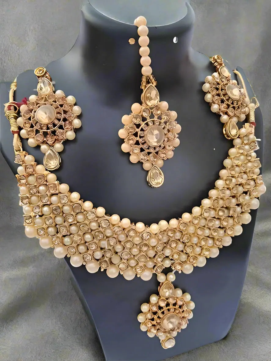 Elegant Golden Harmony Jewelry Set featuring a shimmering gold-plated necklace, earrings, and ring for women by AlinKriti.