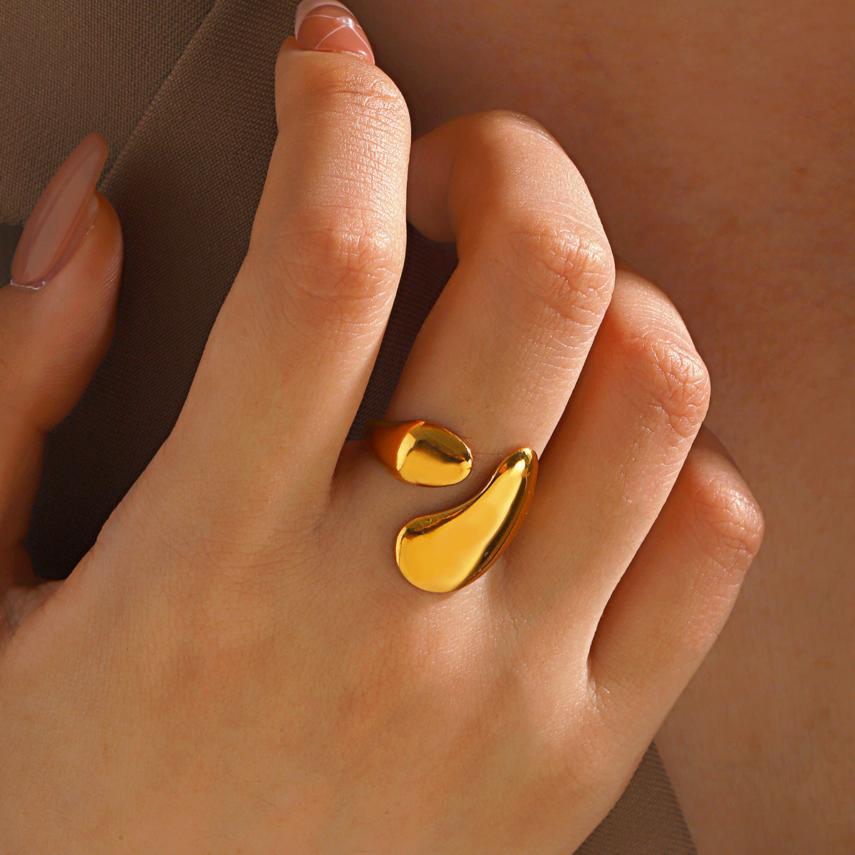 “Stainless steel hip hop ring in gold and steel finish with geometric design for women’s fashion”