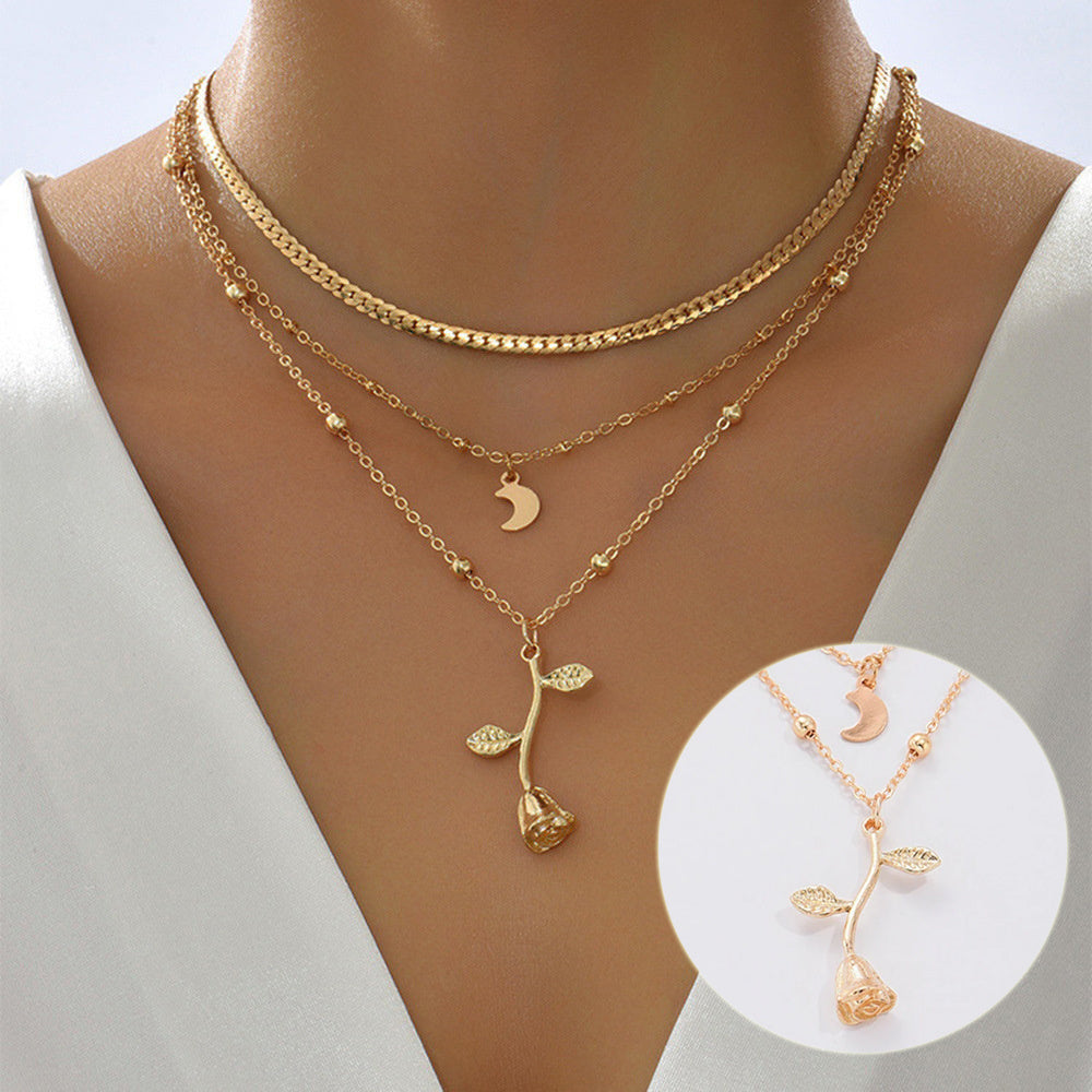 Close-up of Bohemia multilayer moon gold pendant necklace with rose flower choker, elegant jewelry for women